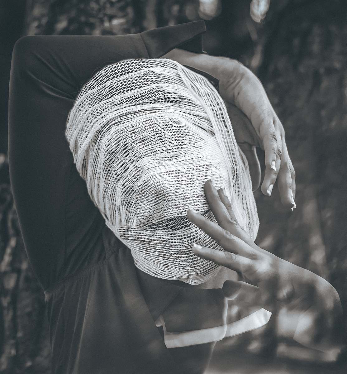 grey greyscale photography of people wearing black long-sleeved shirt finger