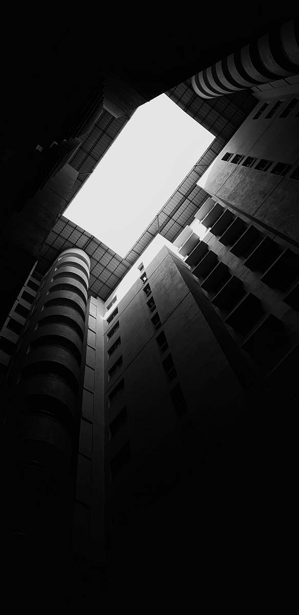 building low-angle grayscale photography of a high-rise building office building