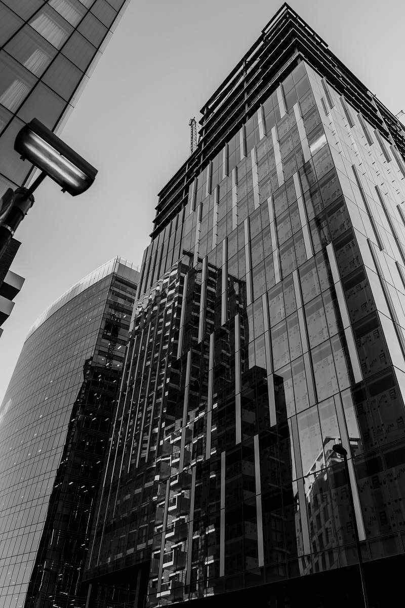 building low-angle grayscale photography of high-rise glass building office building