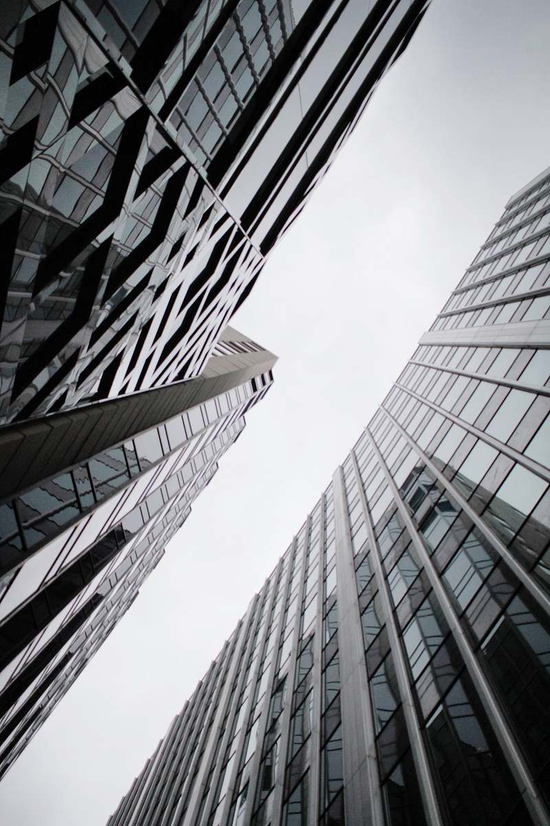 architecture low angle photography of curtain wall glass buildings building