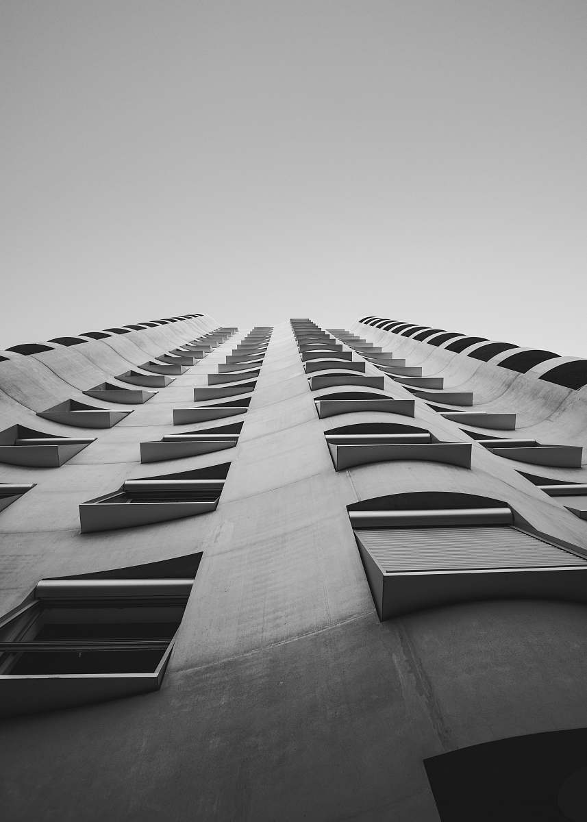 grey low-angle photography of gray concrete building building