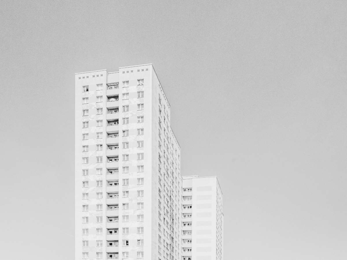 building low angle photography of highrise building housing