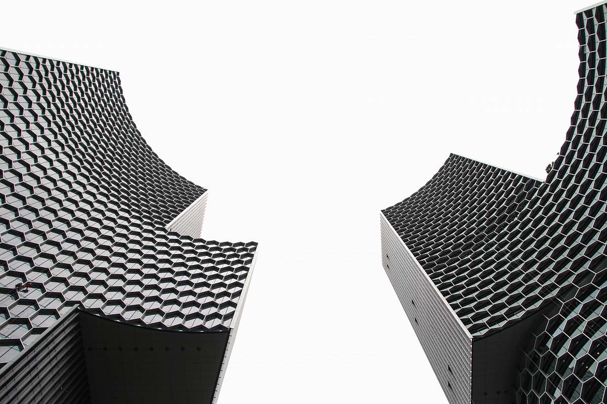 chair low angle photography of two high-rise buildings furniture