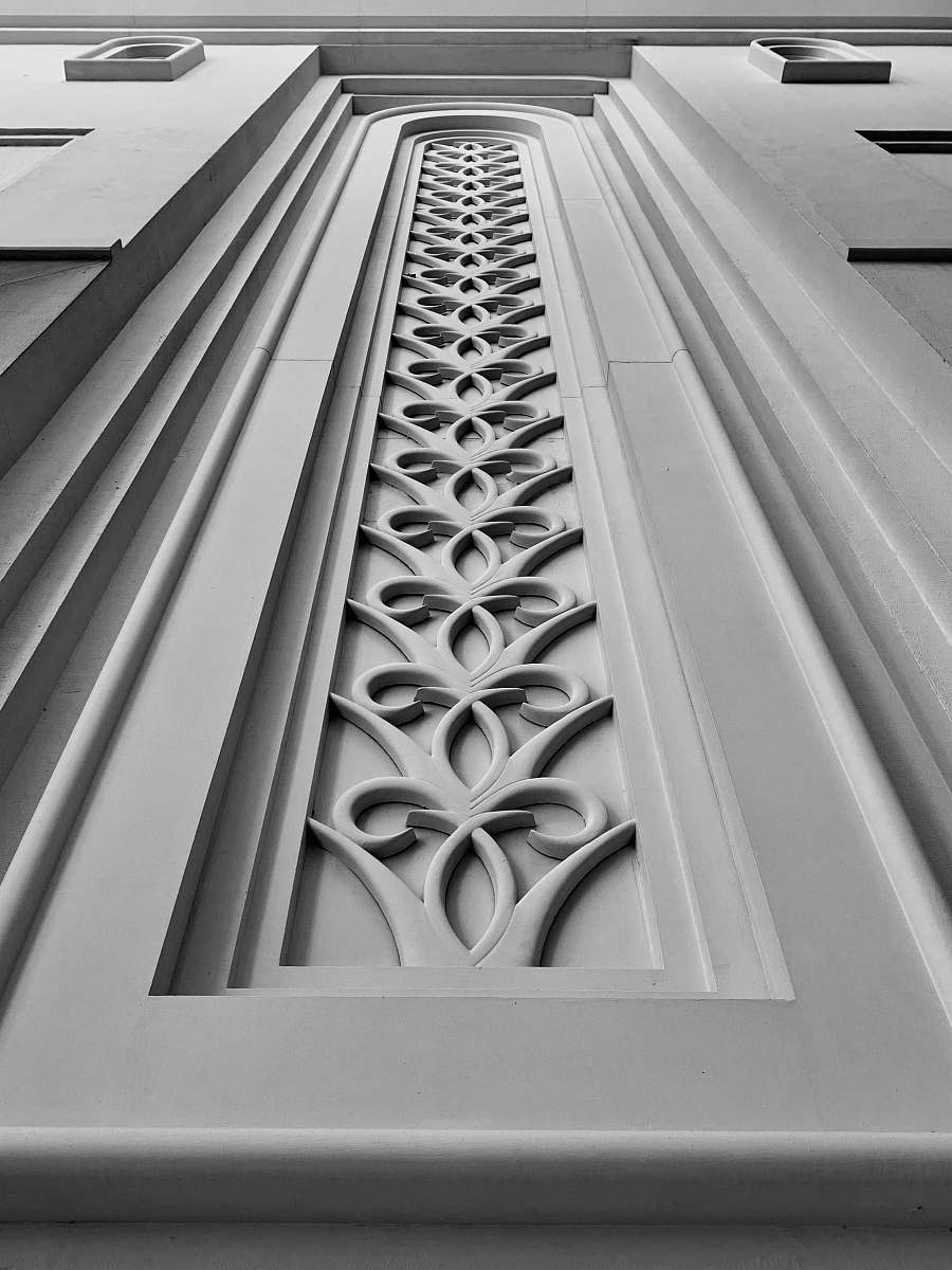 word low-angle photography of white concrete building grey