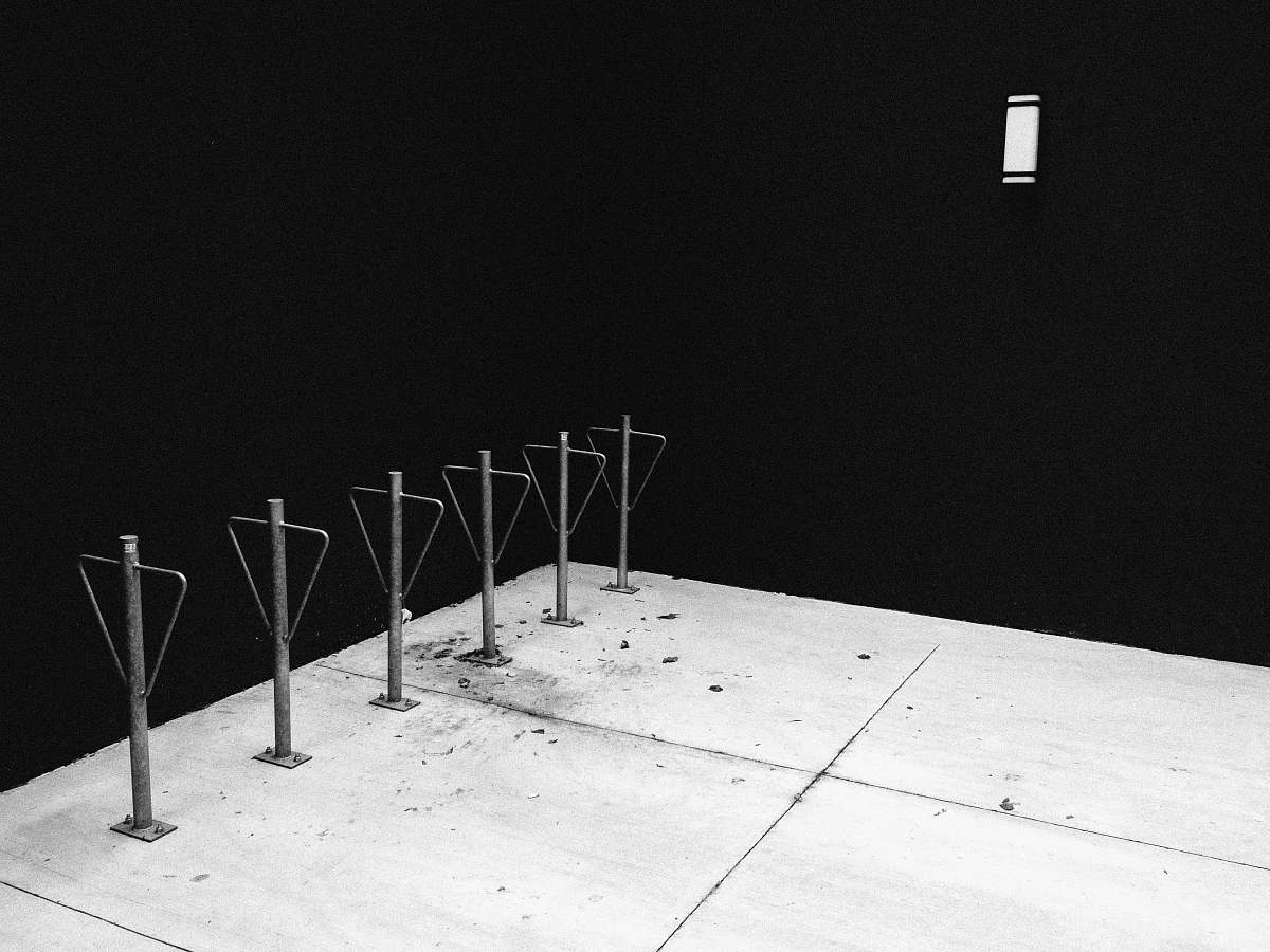toronto low light photography of metal poles chair