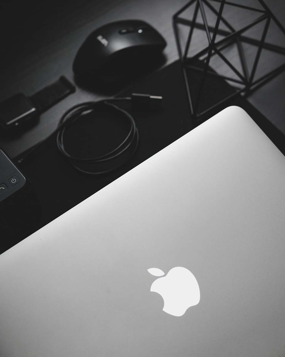 mouse MacBook near black computer mouse logo