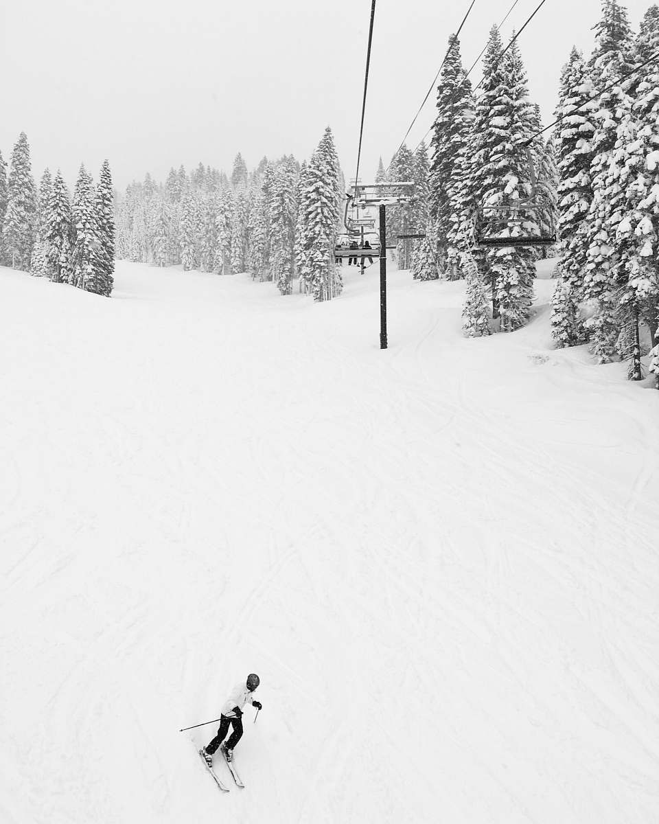 snow man doing ski near cable car skiing