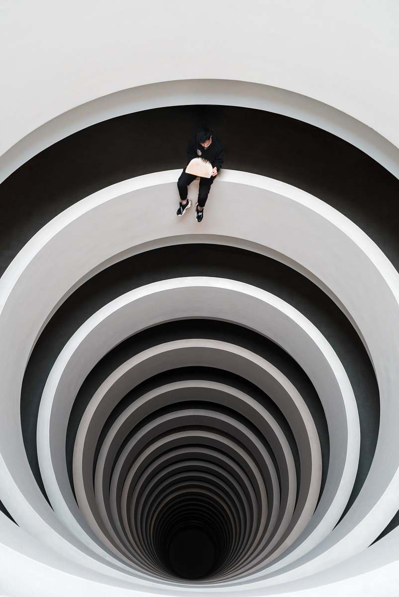 human man sitting on deep pit design person