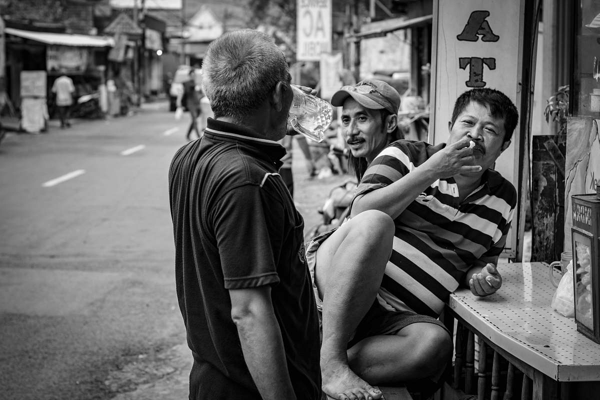 human man sitting on the chair greyscale photography person