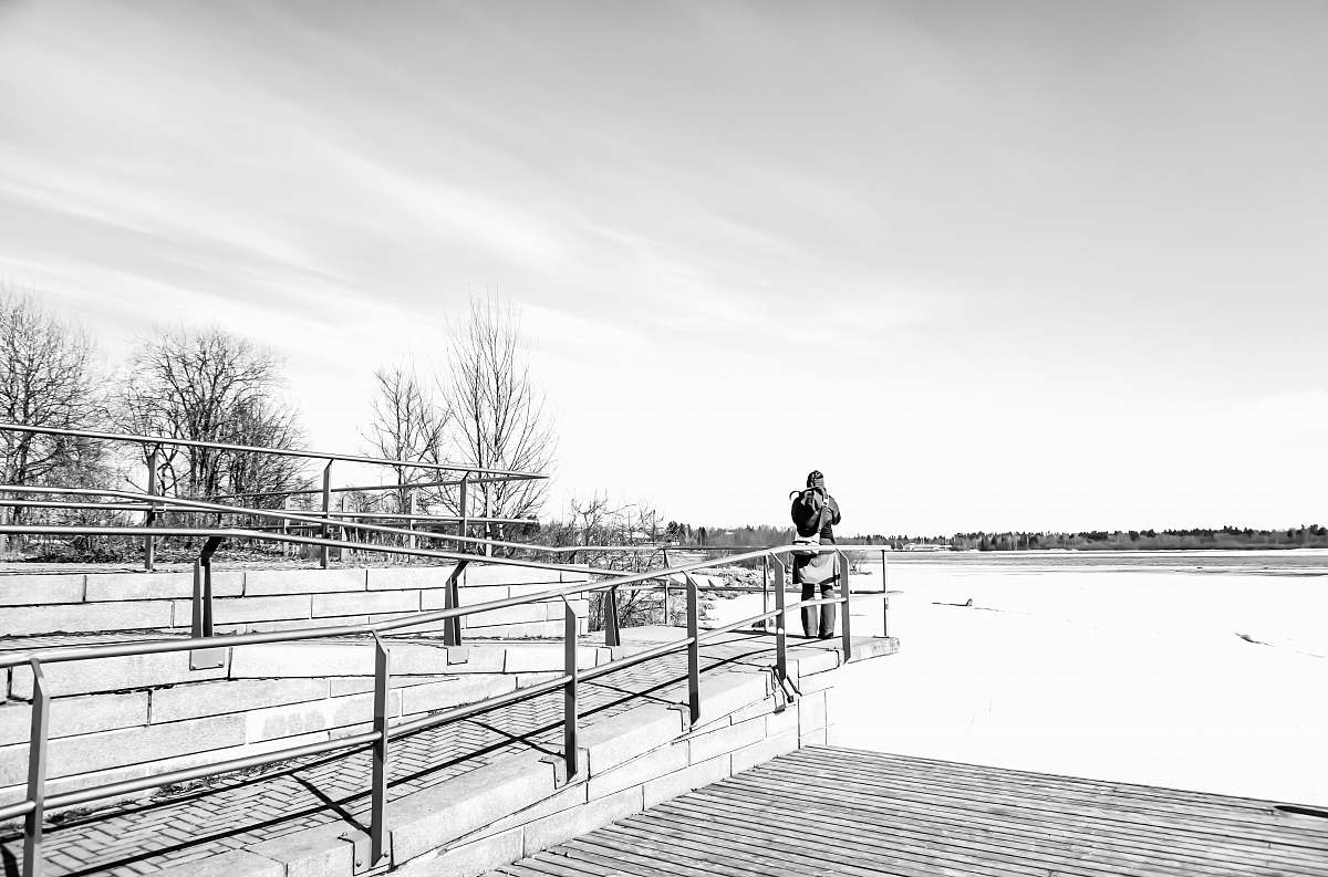 banister man standing beside railings handrail