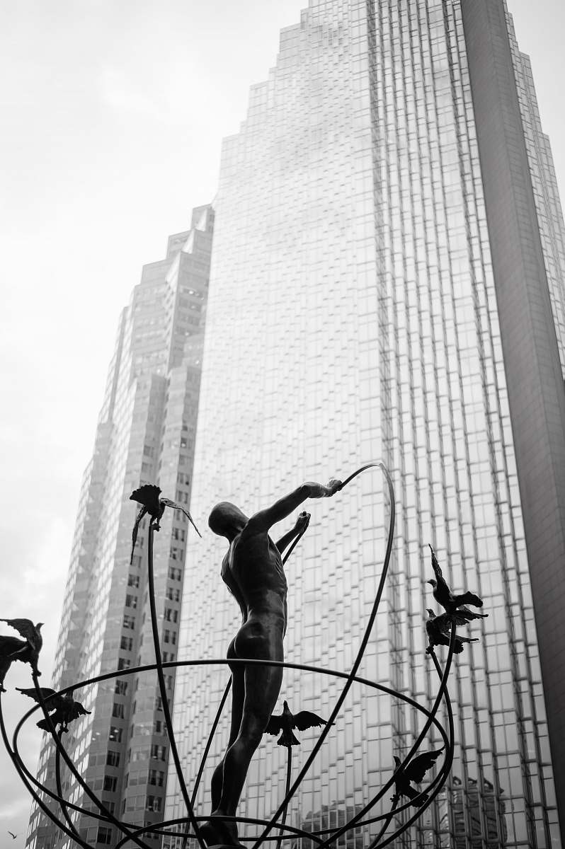 building man statue near building city