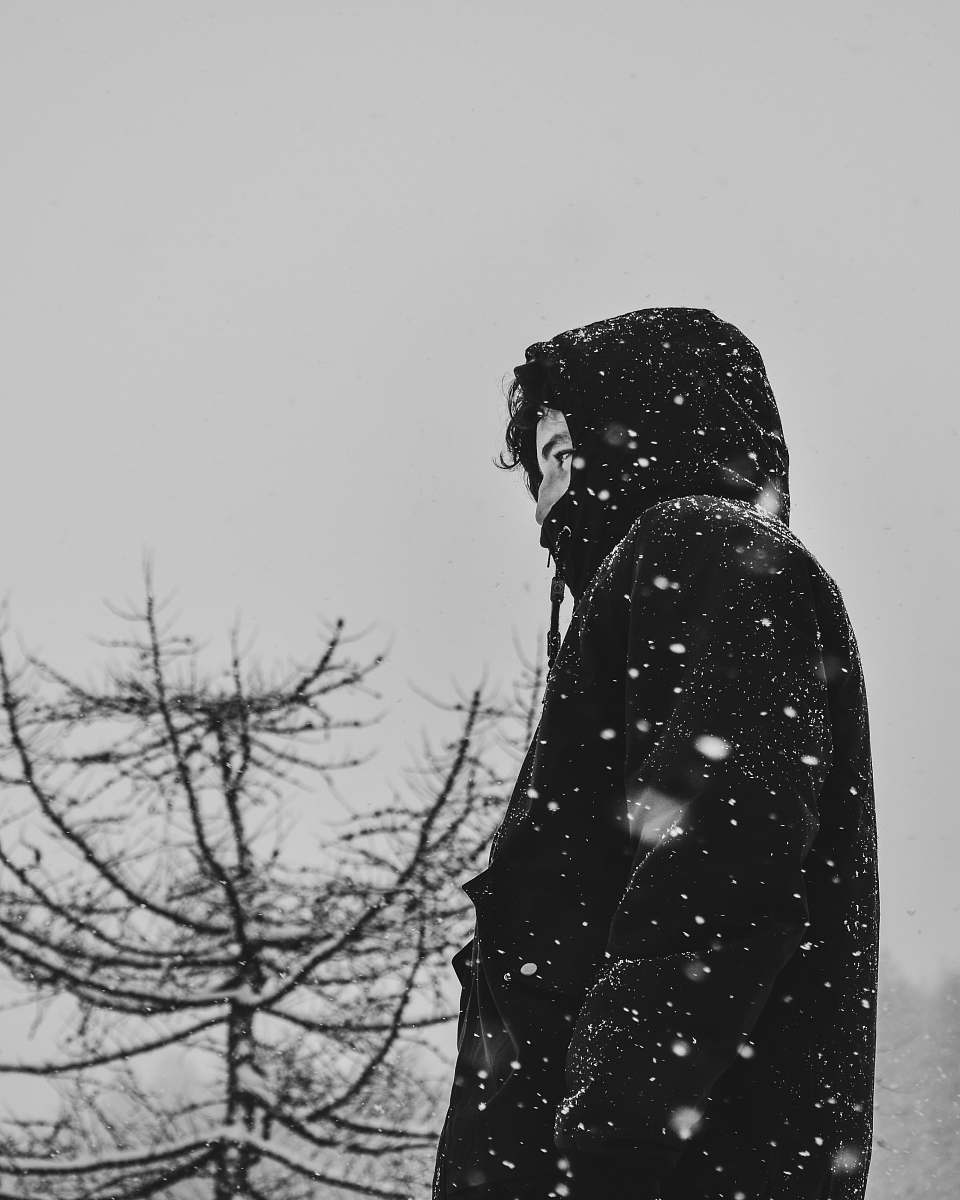 snow man wearing black hoodie valgrisenche