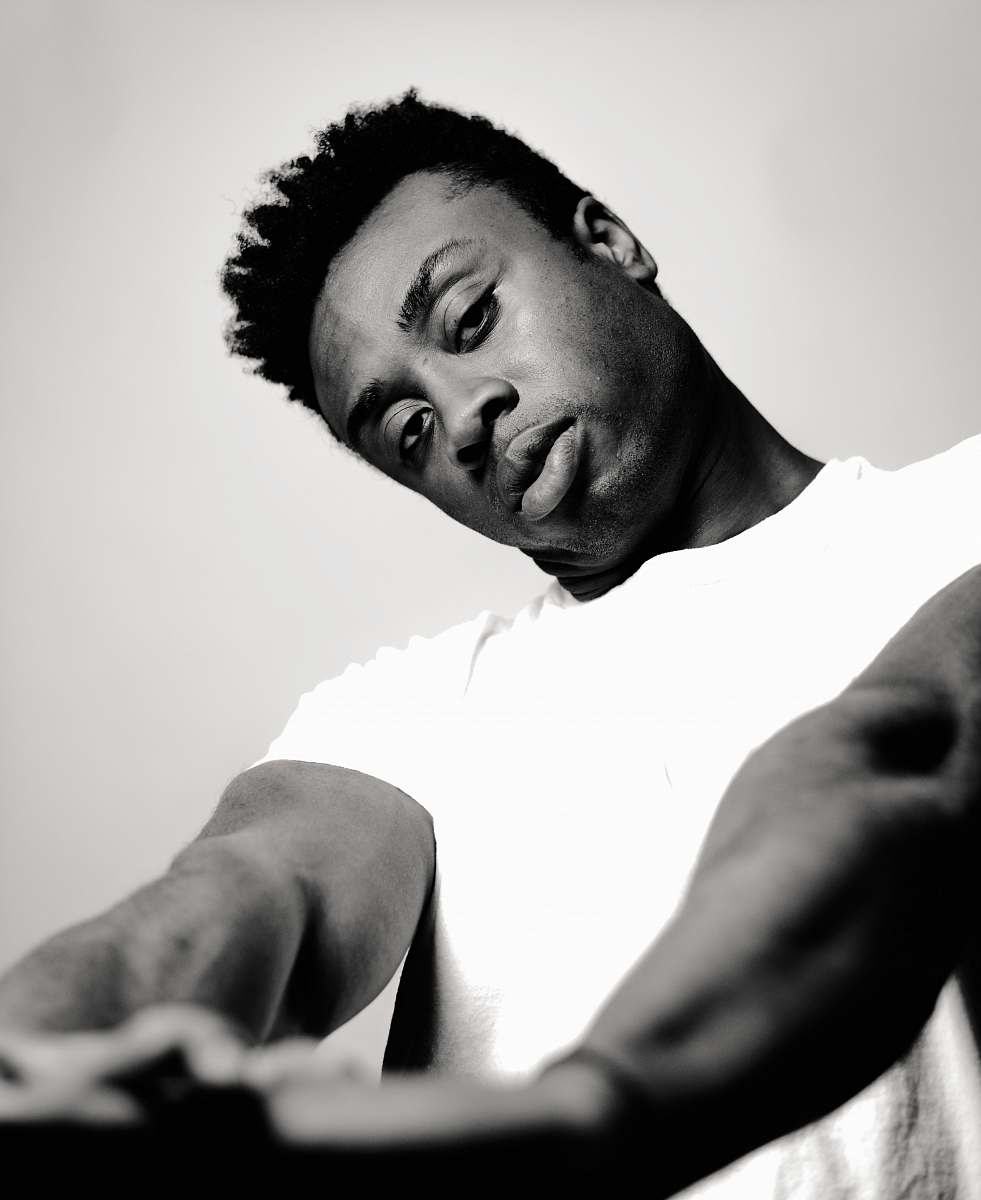 human man wearing crew-neck t-shirt grayscale photo person