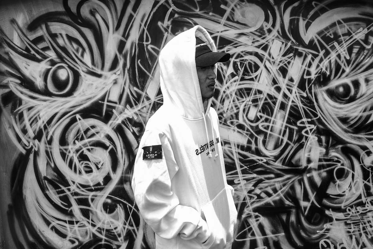 apparel man wearing white and black pullover hoodie clothing