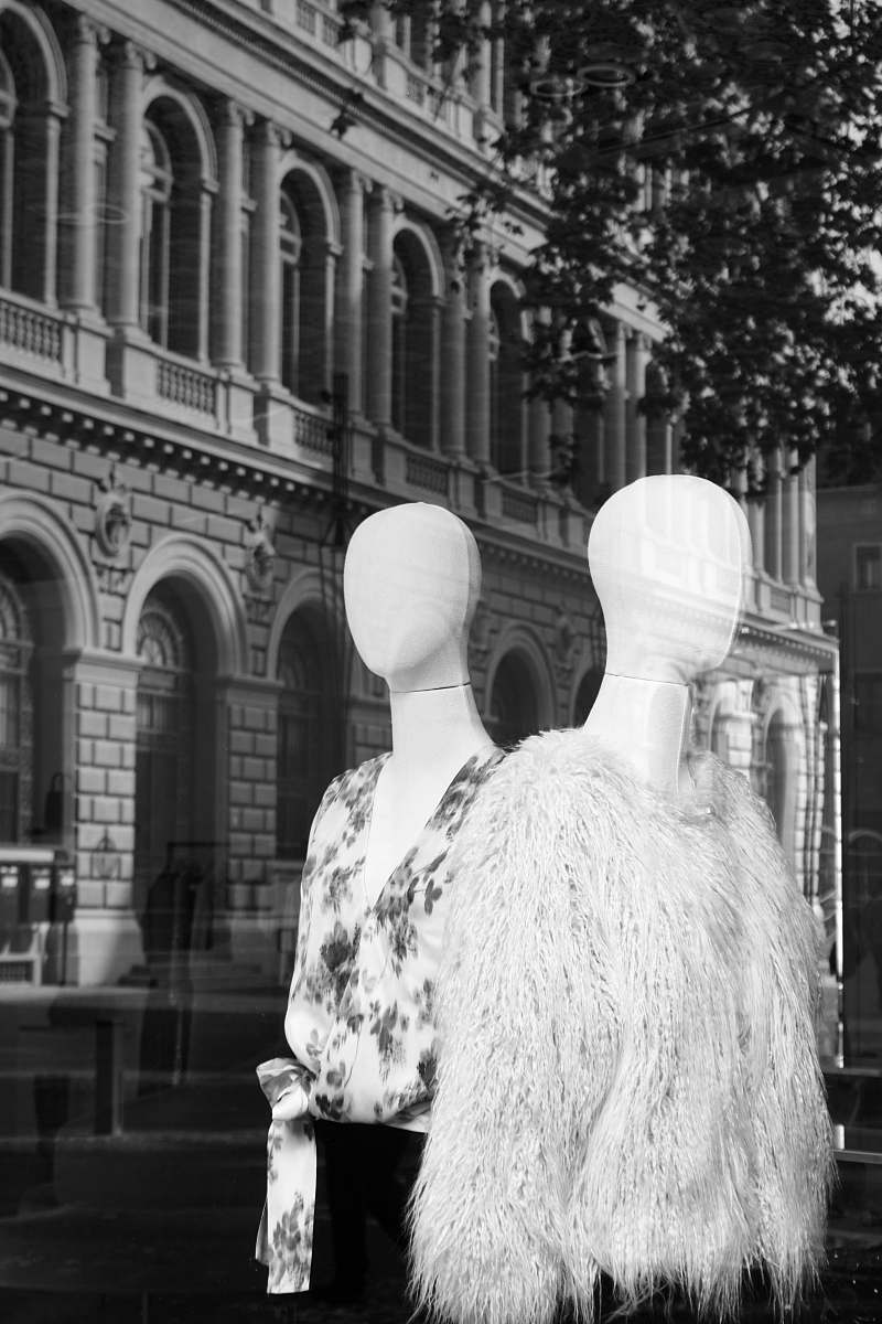 apparel mannequin wearing white coat clothing