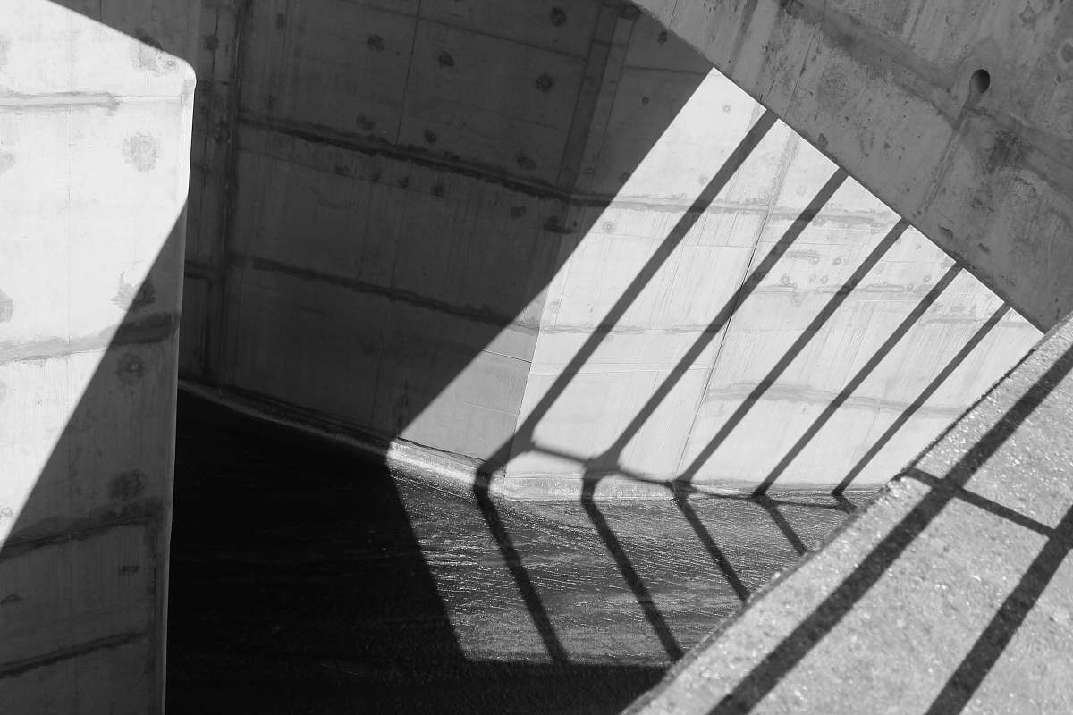 architecture minimalist photography of gray wall with grill shadows shadows