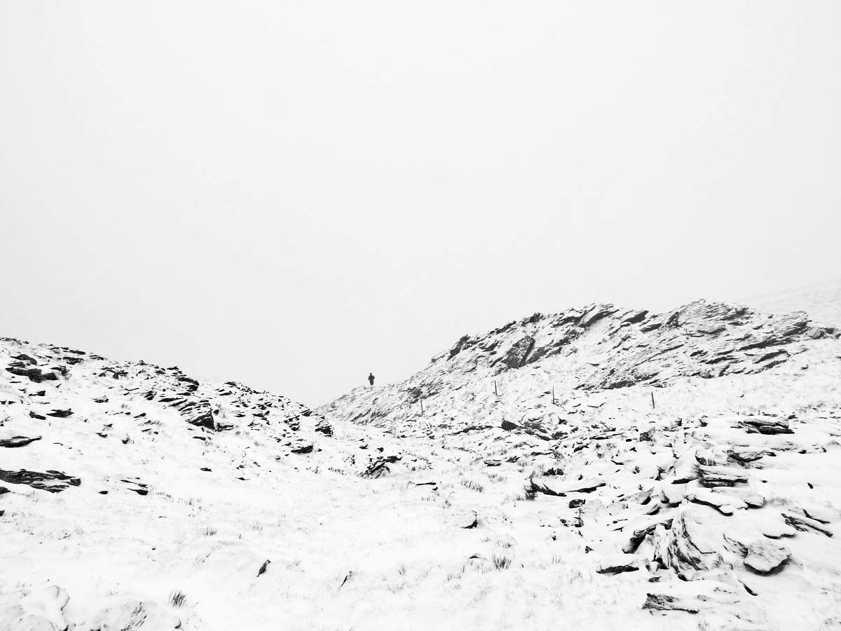 mountain mountain covered with snow under white sky white