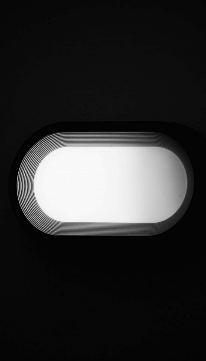 window oval gray framed mirror light fixture