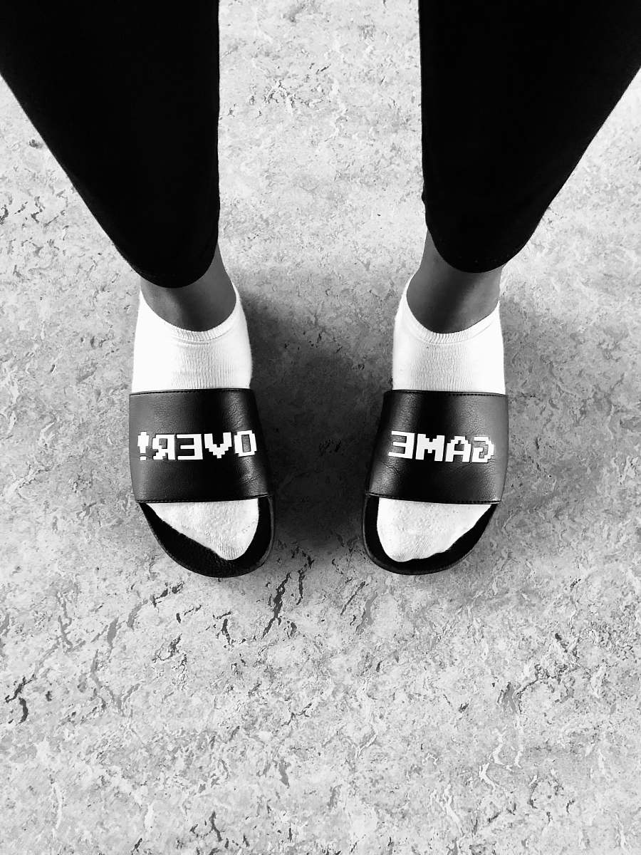 apparel pair of black slide sandals clothing