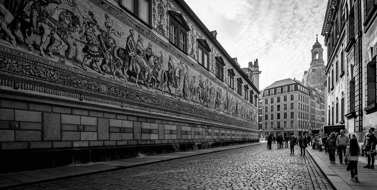 path people walking by concrete wall walkway