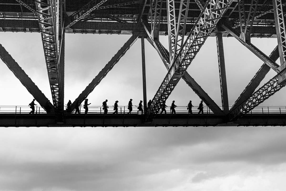 building people walking on bridge human