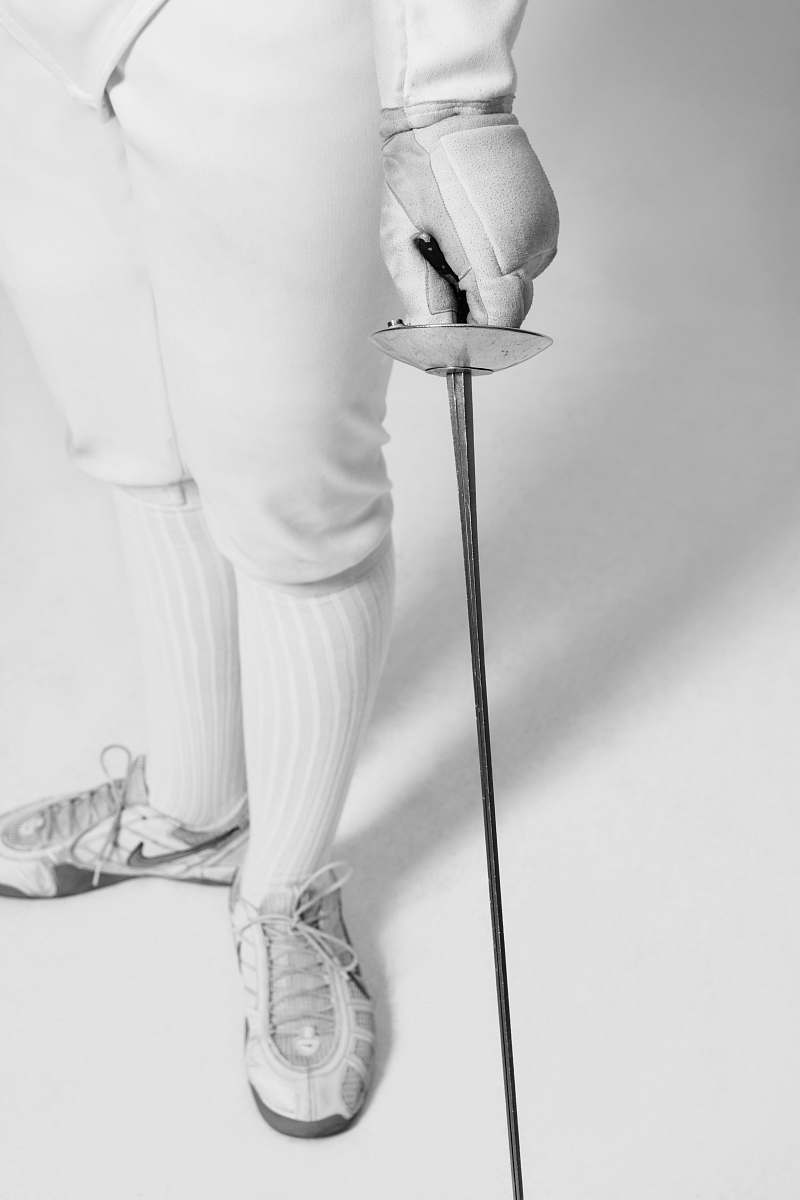clothing person holding fencing sword apparel