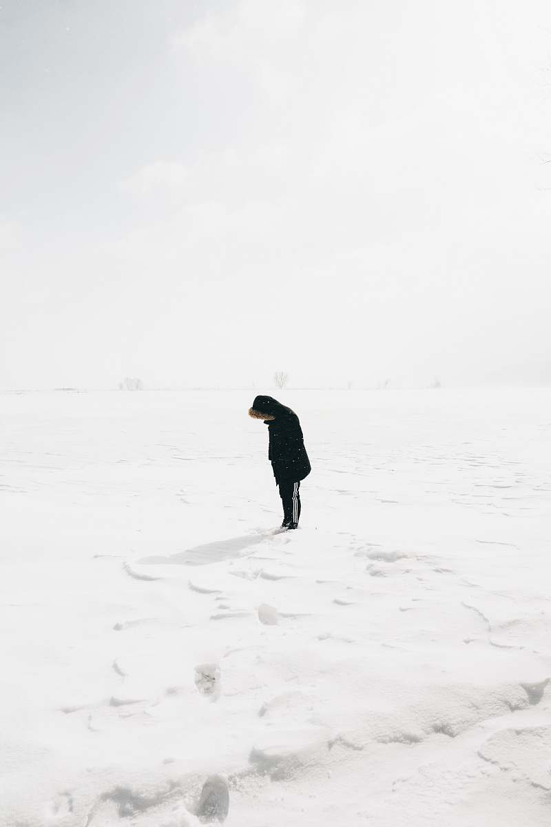 nature person standing on snow covered field person