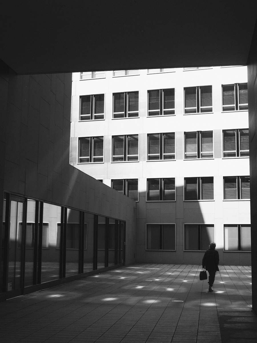 human person walking near building person