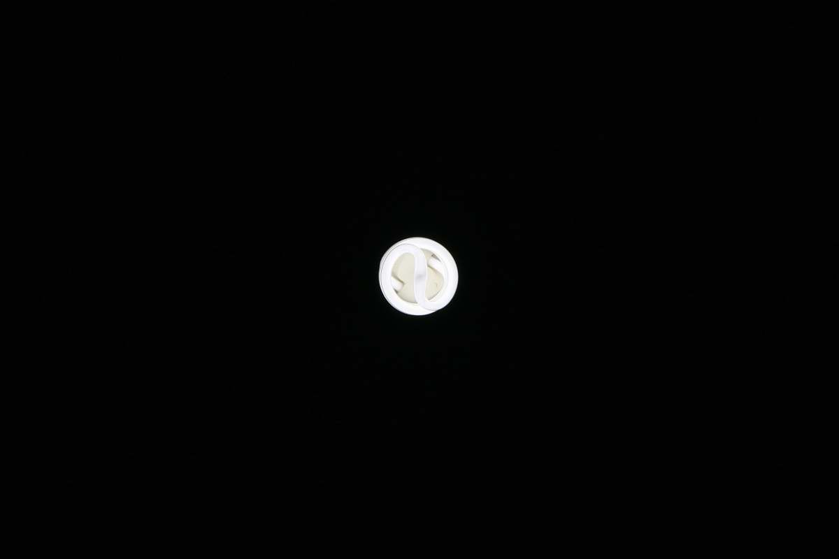 astronomy round white ornament on black surface moon