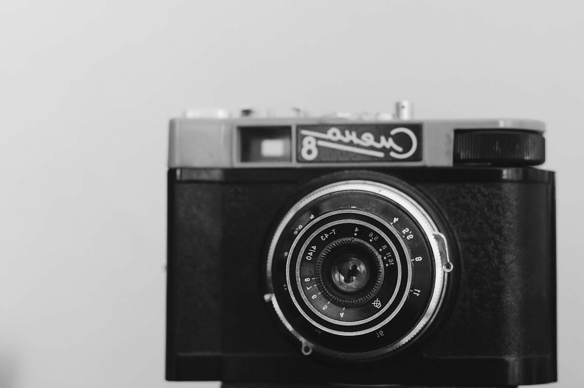 camera shallow focus photography of black camera electronics
