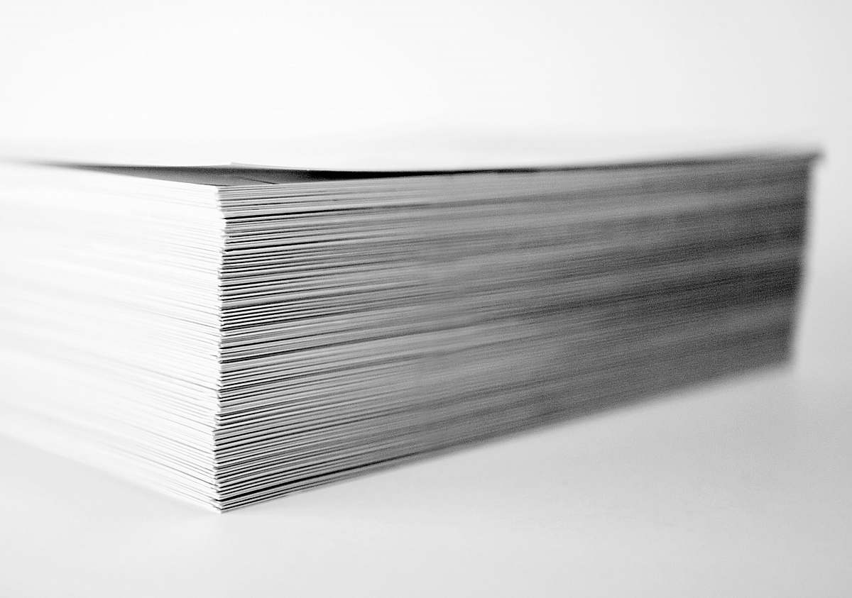 grey stack of papers paper