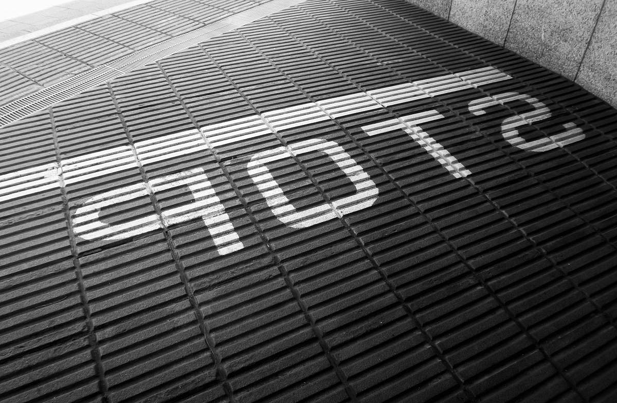 grey Stop signage brick