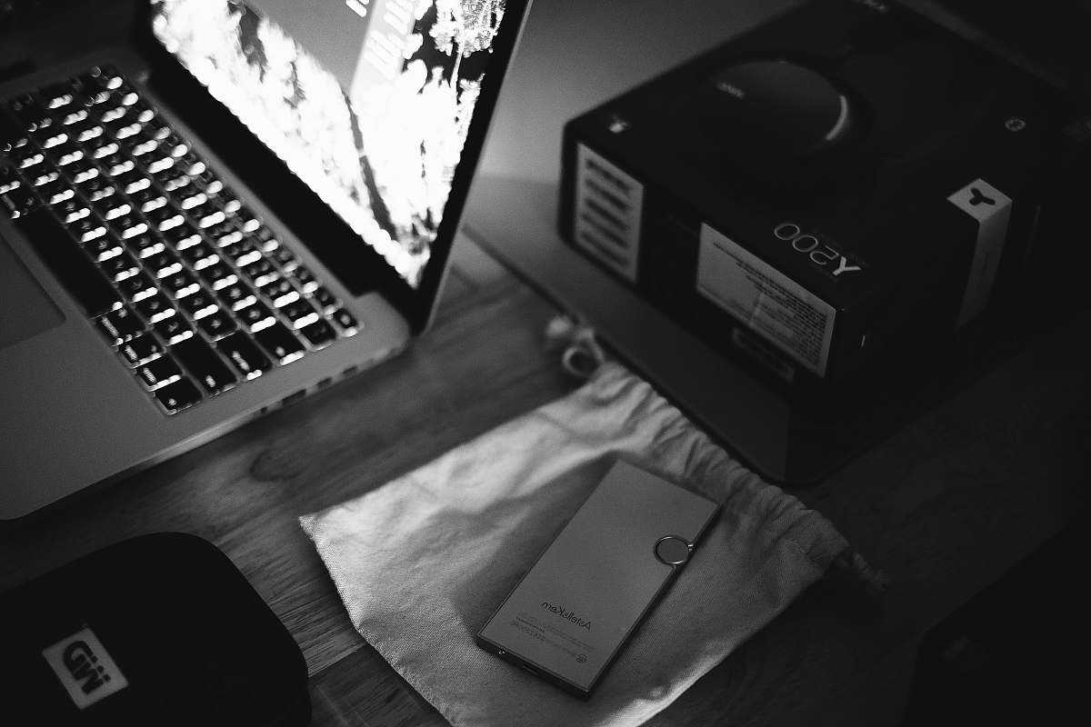 computer turned on laptop near items computer hardware