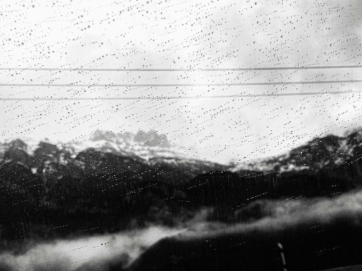 white view of mountains during a rainy weather rain