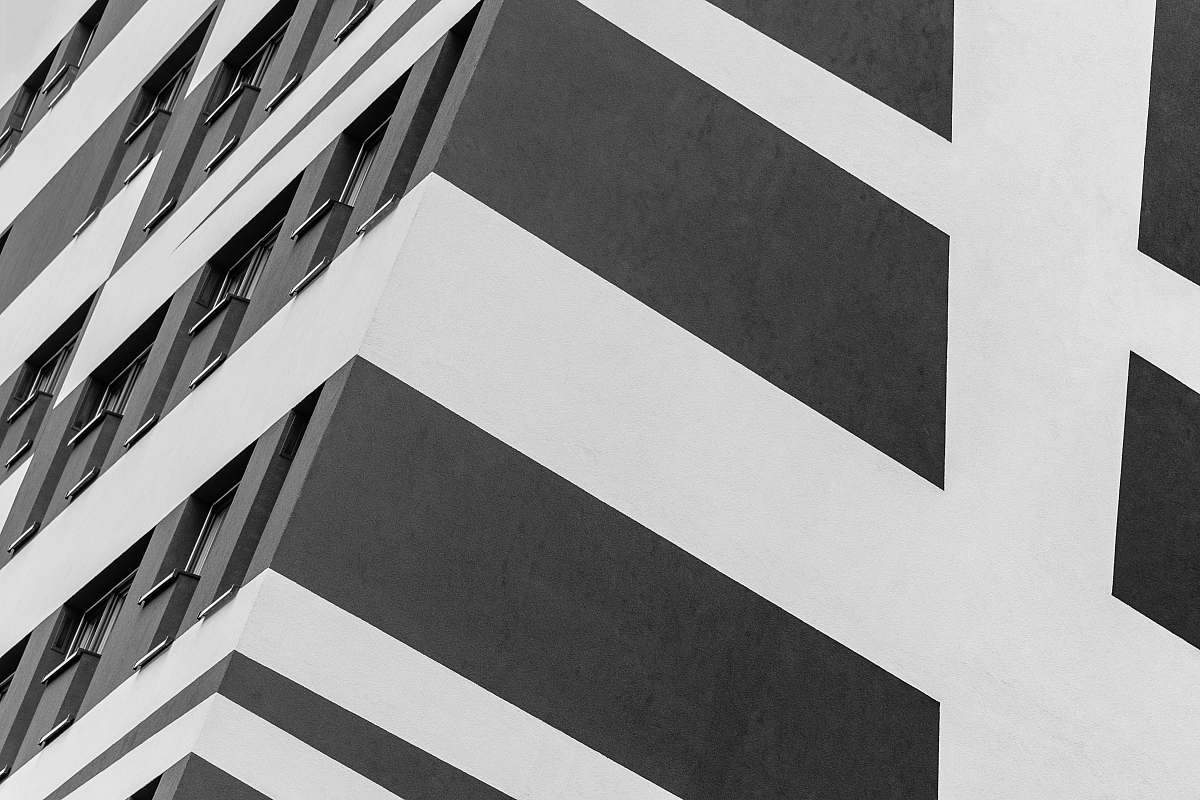 grey white and black painted building building