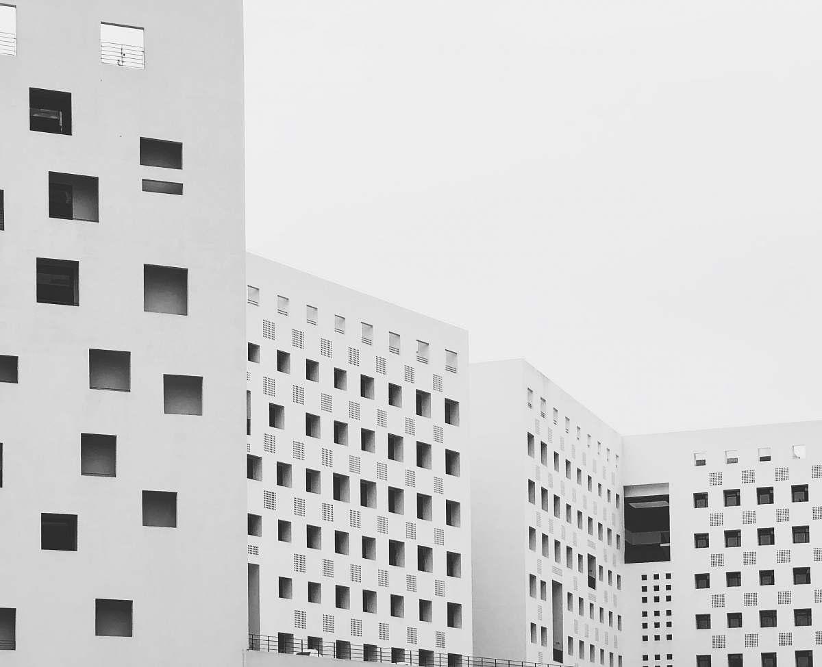 building white buildings under white sky office building