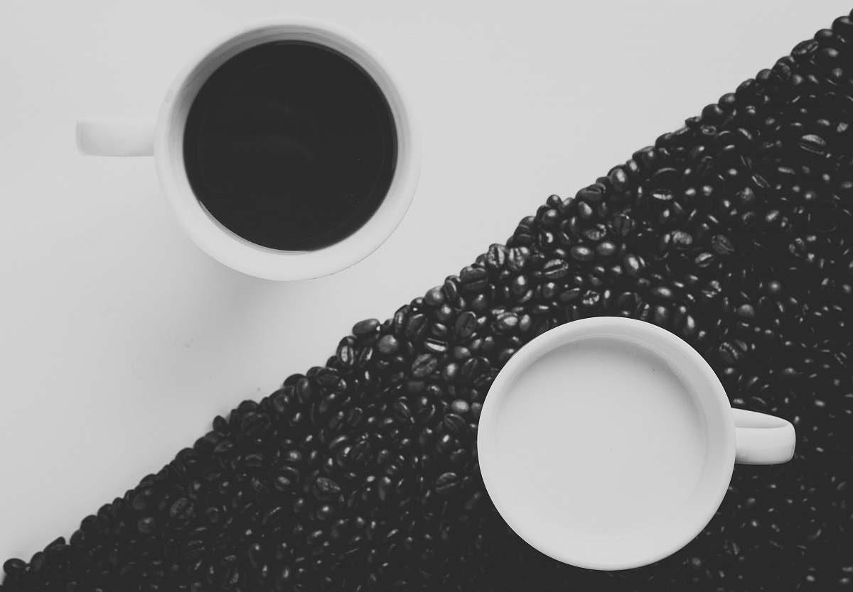 coffee white ceramic coffee mug filled with black liquid beans
