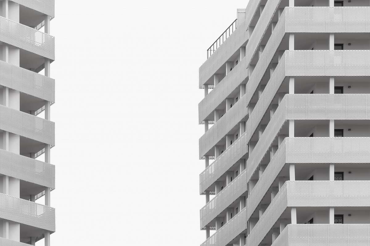 building white concrete buildings under white sky urban