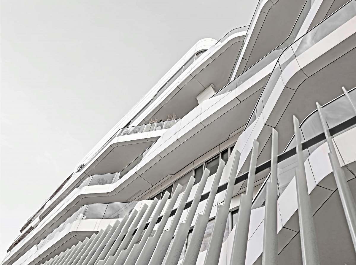 grey white concrete fence near building building