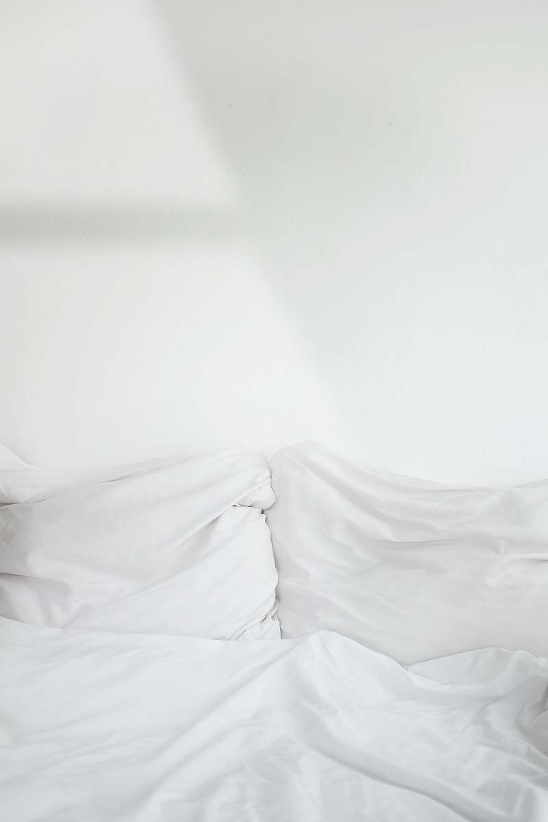 grey white textile cushion