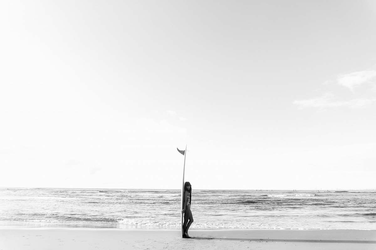 ocean woman leaning on surfboard outdoors