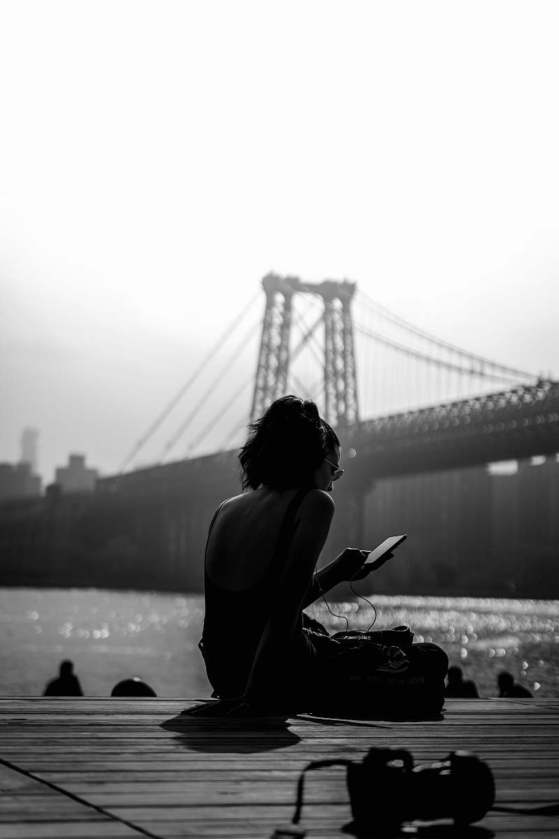 human woman sitting on dock person