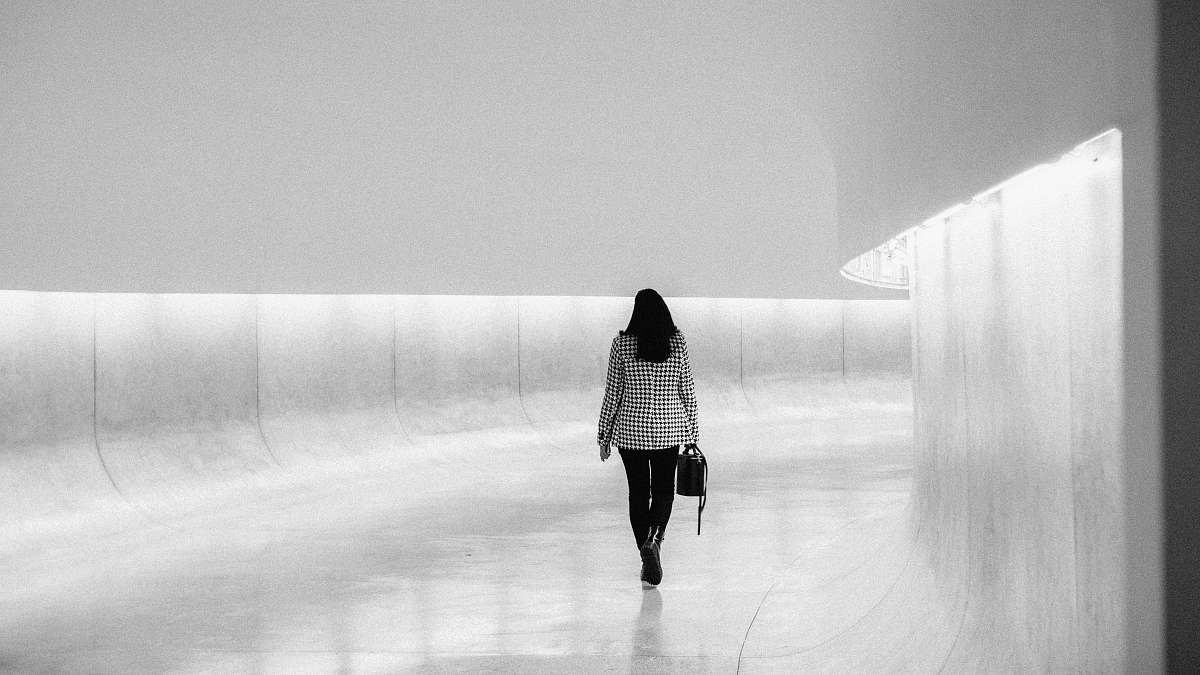 human woman walking on hallway person