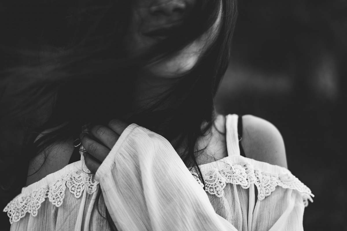 grey woman wearing cold shoulder blouse libya