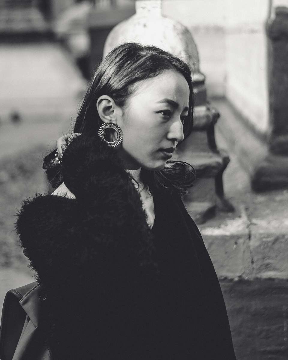 human women's black long-sleeved coat person