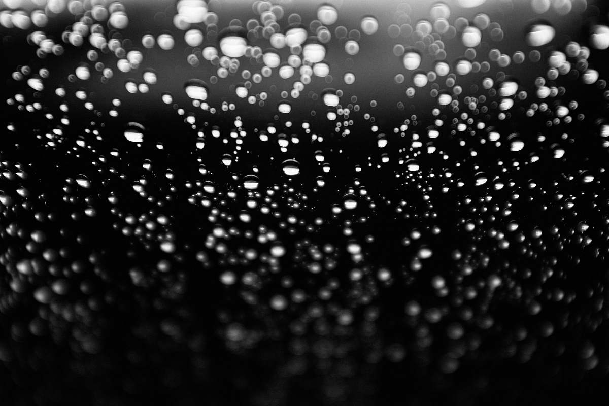 black-and-white glass with water droplets water