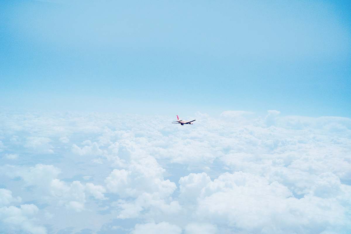 clouds flying airplane above clouds flight