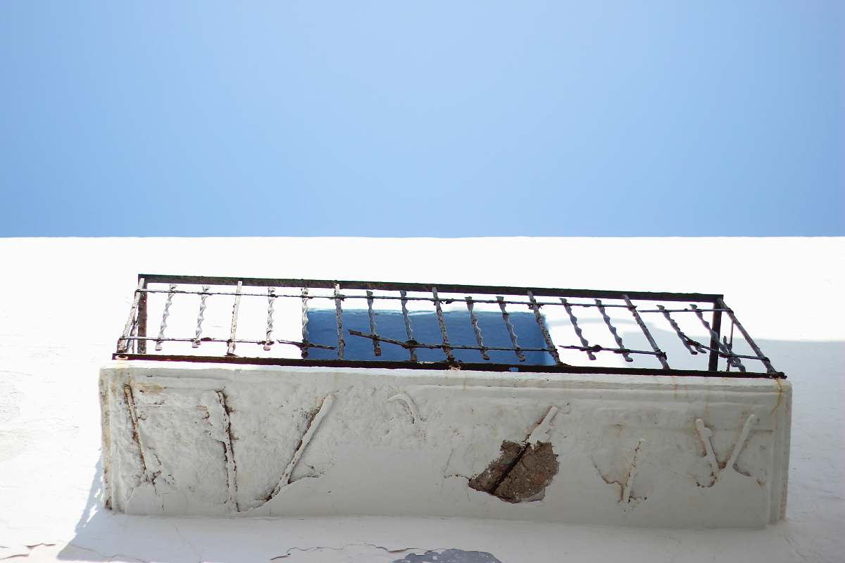 peniscola low angle photography of black metal balcony rails balcony