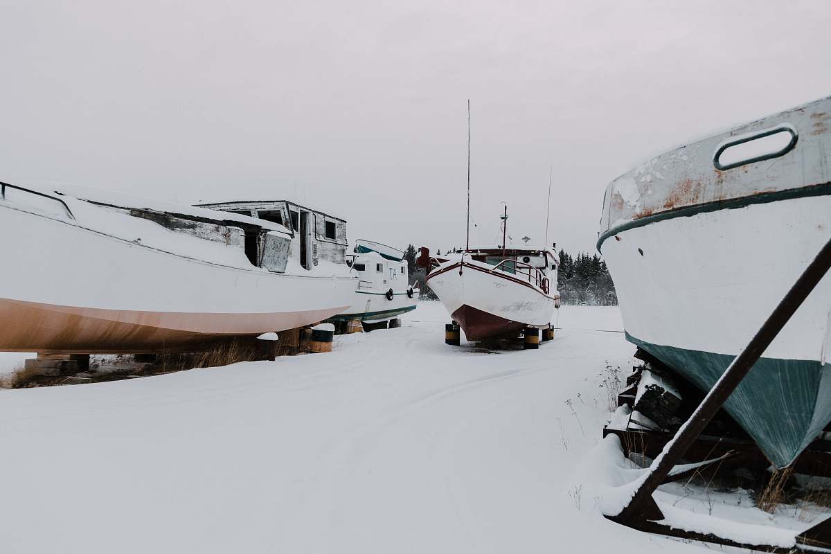 snow three boats on snow ground ice