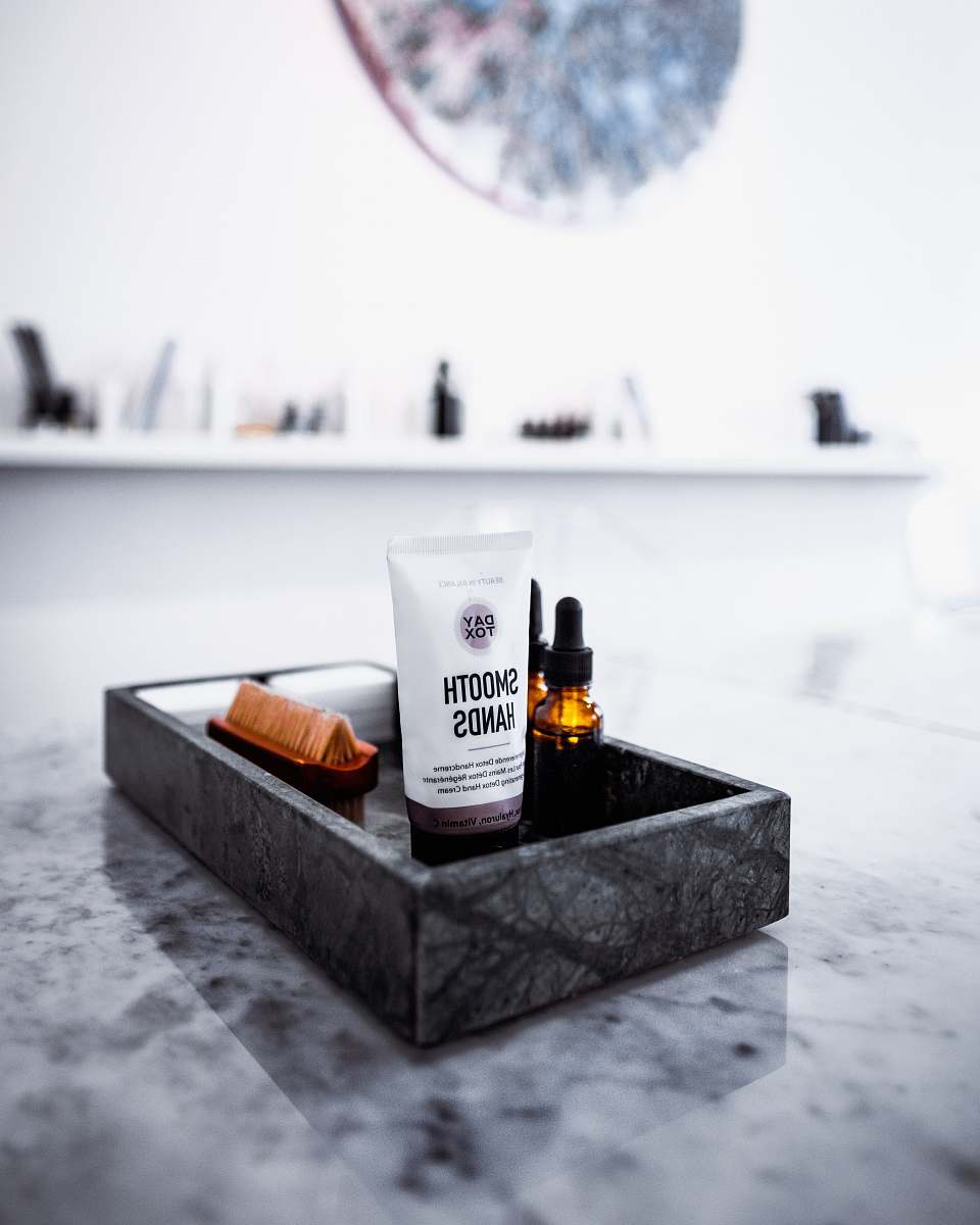 alcohol selective focus photo of Smooth Hands soft-tube in rectangular gray tray beverage